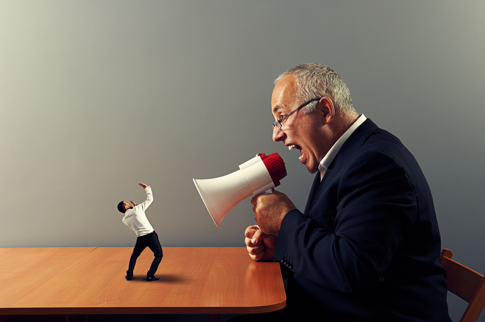 senior boss screaming at small businessman