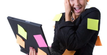 Businesswoman with notebook and reminding notes