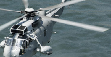 a royal Australian navy rescue helicopter performing a public rescue demonstration for Australia day