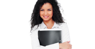 beautiful young businesswoman with folder. isolated on white background