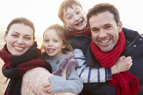 Portrait Of Family On Winter Beach