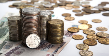 stacks of Russian rubles with note close up