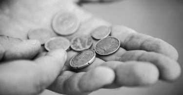 Euro Cent coins in the hands of hard worker