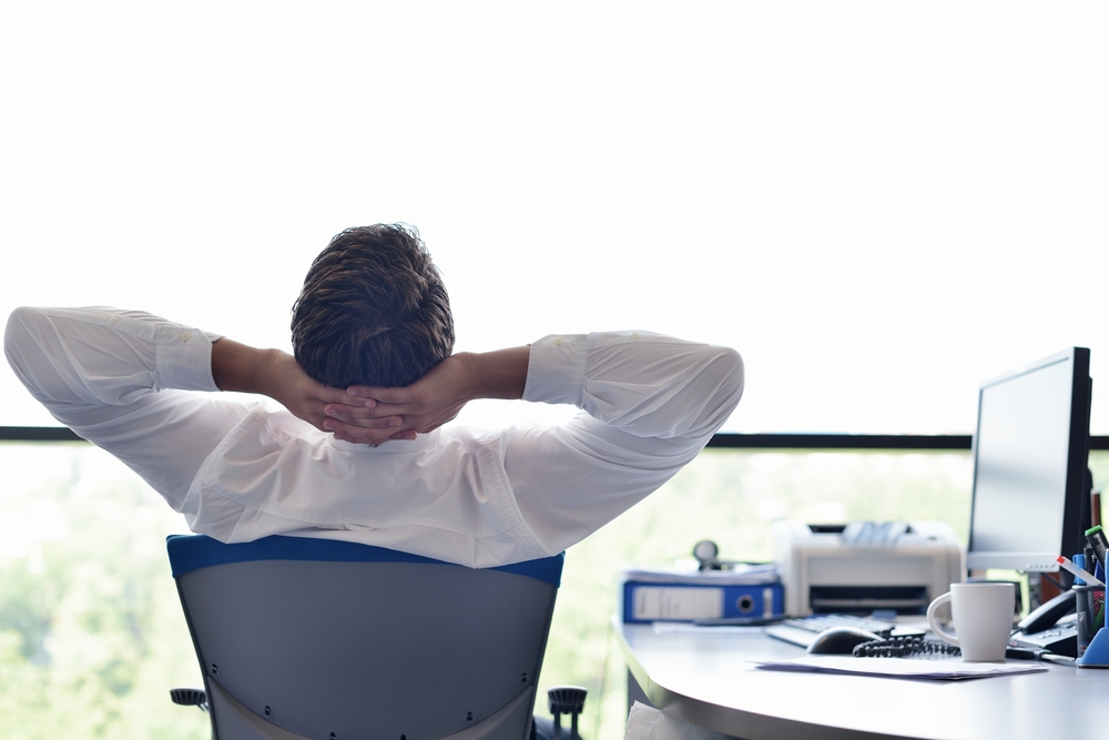 happy young business man work in modern office on computer