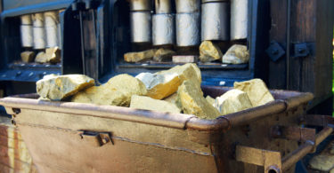 Trolley with gold ore in the gold mine in museum