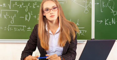 Portrait of a teacher giving a lecture at a classroom..